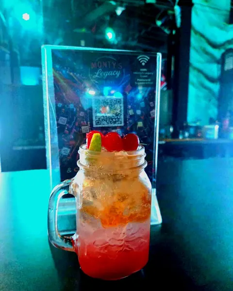 Punch'n Fizz cocktail in a jar glass at Monty's Legacy