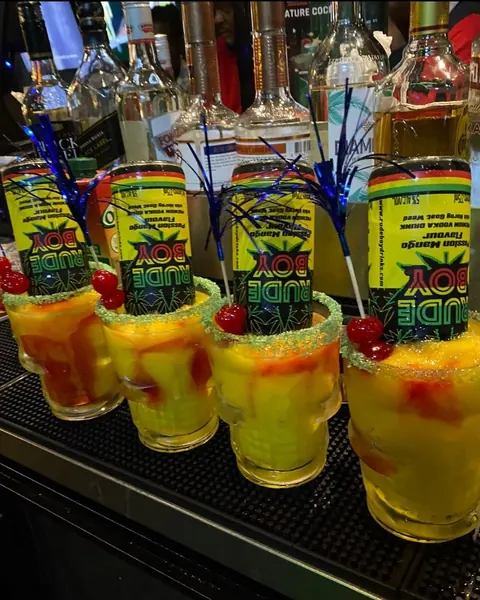 Ultimate Passion cocktails lined up on the bar at Monty's Legacy