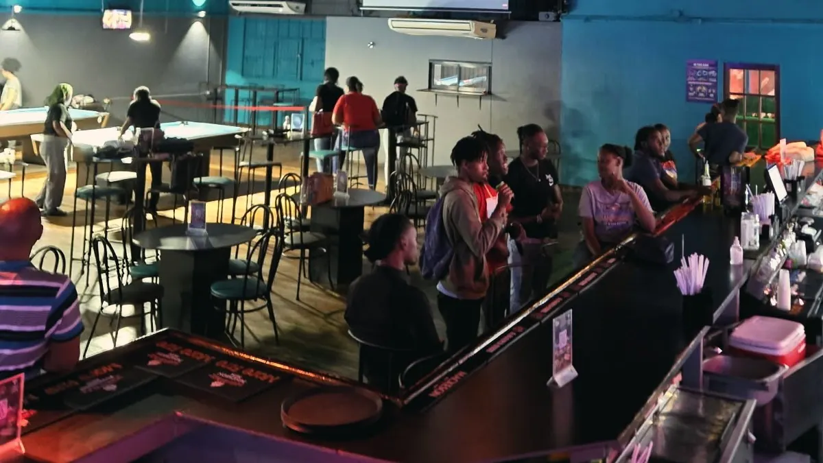 Guests at the bar and pool tables inside Monty's Legacy, San Fernando
